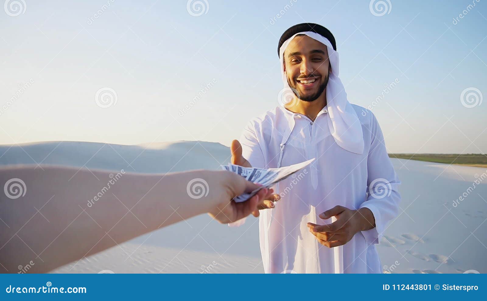 arab male sales representative looks at camera and tells informa
