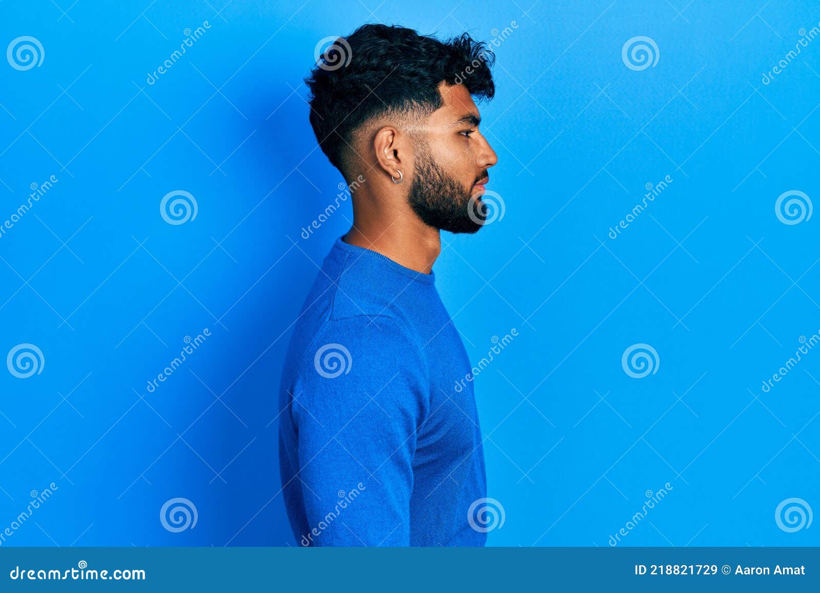 Arab Man with Beard Wearing Casual Blue Sweater Looking To Side, Relax ...