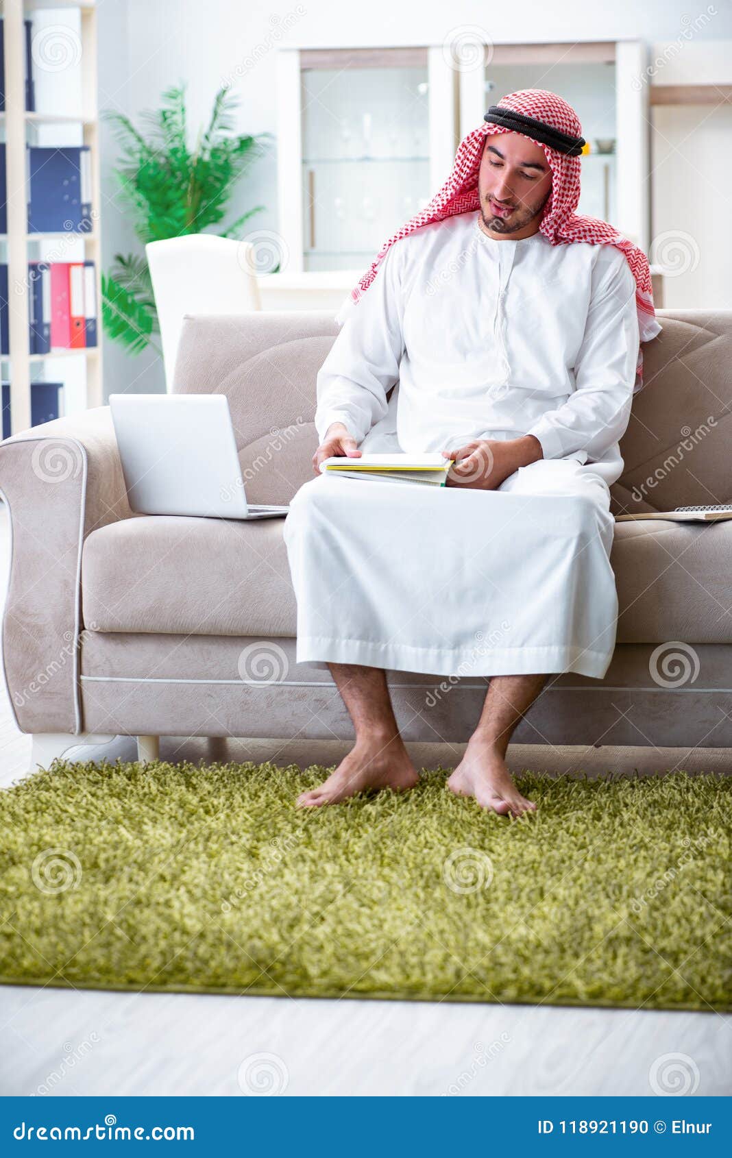 The Arab Man Working at Home on His Work Stock Photo Image of freelancing, headscarf 118921190