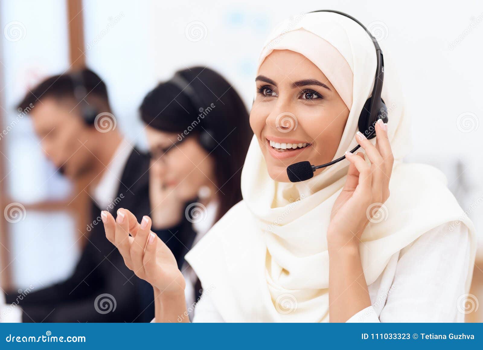 An Arab Woman Works in a Call Center. Arabian Works at Office. Stock