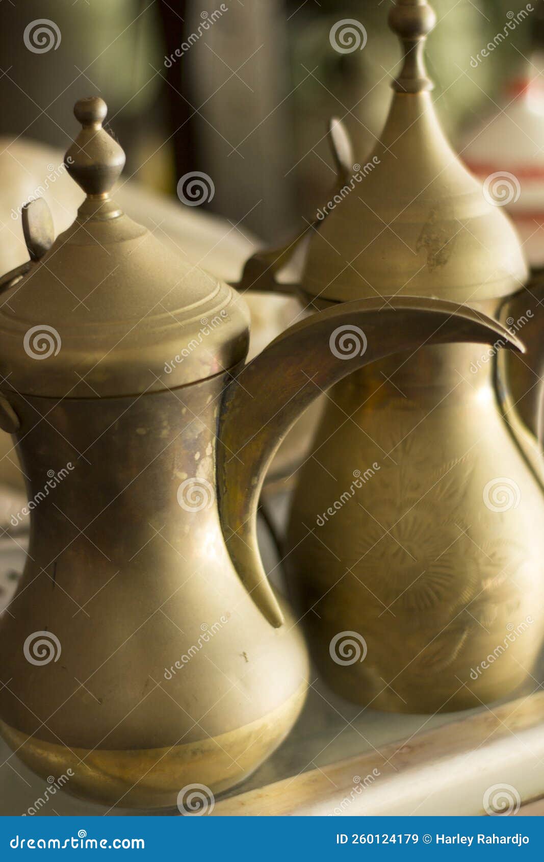 display of old unique teapot made of brass