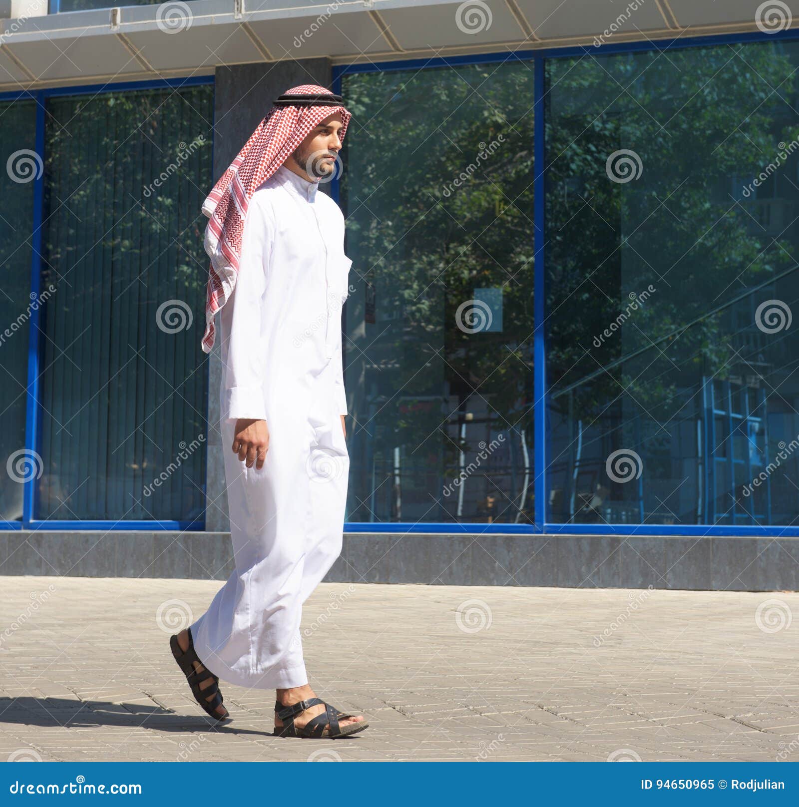 Arabian Man Walking Along the Street Stock Image - Image of arabic ...