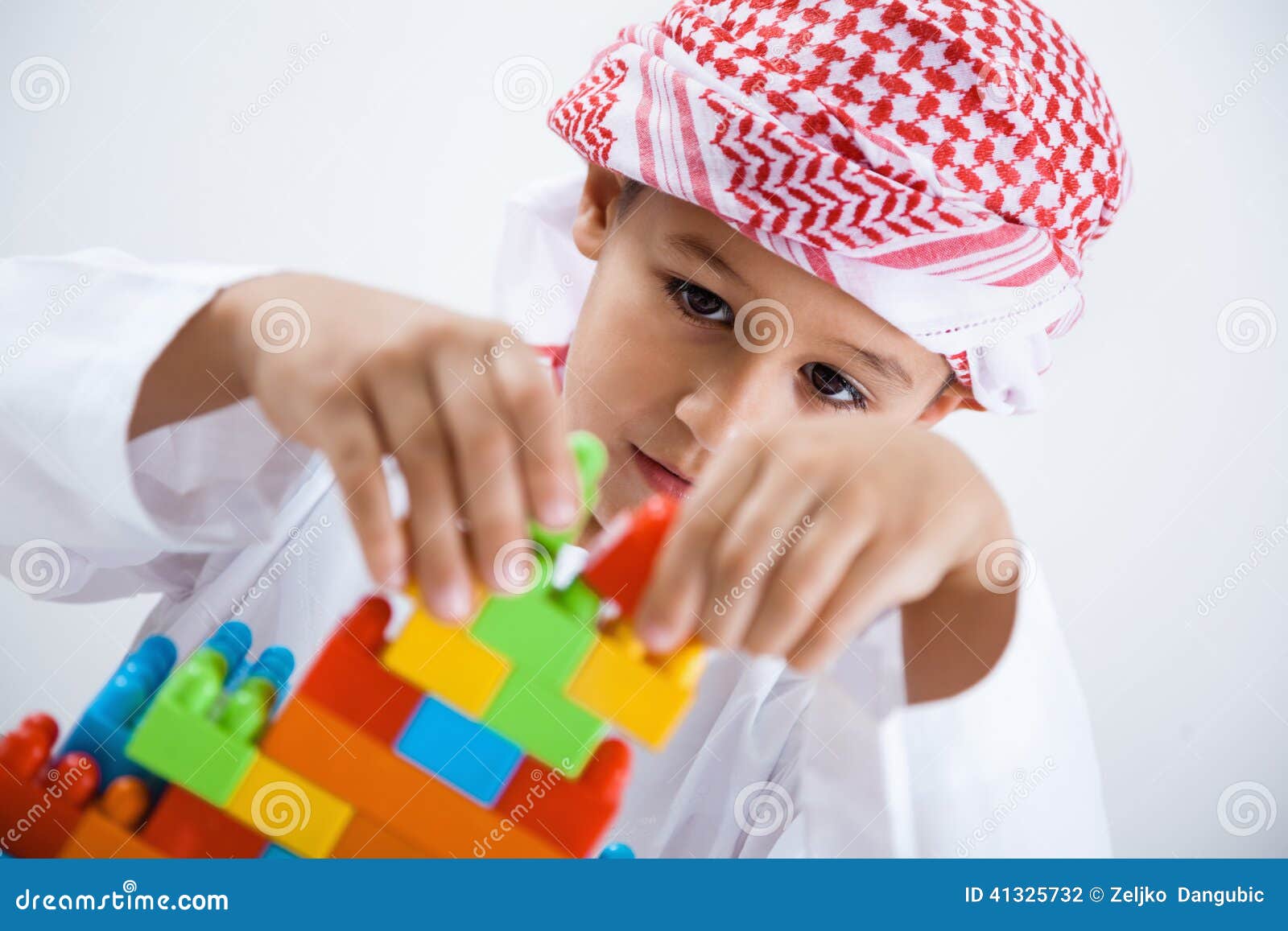 Arabic little boy playing stock photo. Image of colorful 41325732