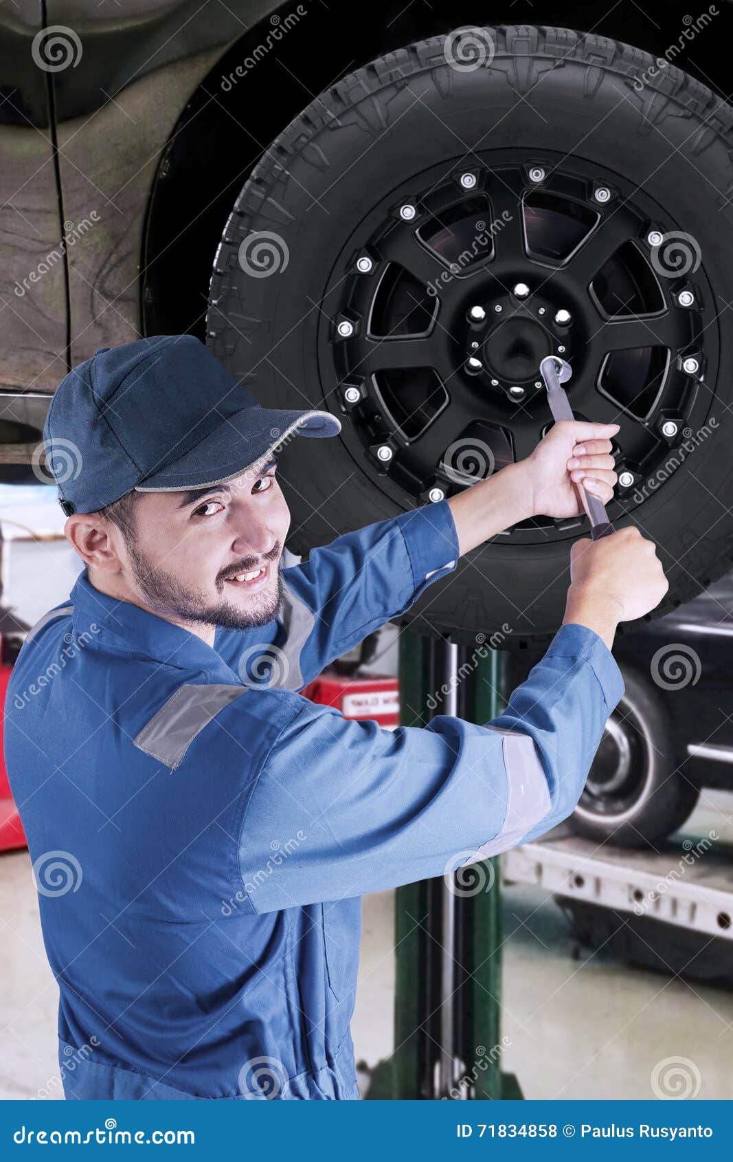 Arabic Mechanic Replacing a Car Wheel Stock Photo Image of replace