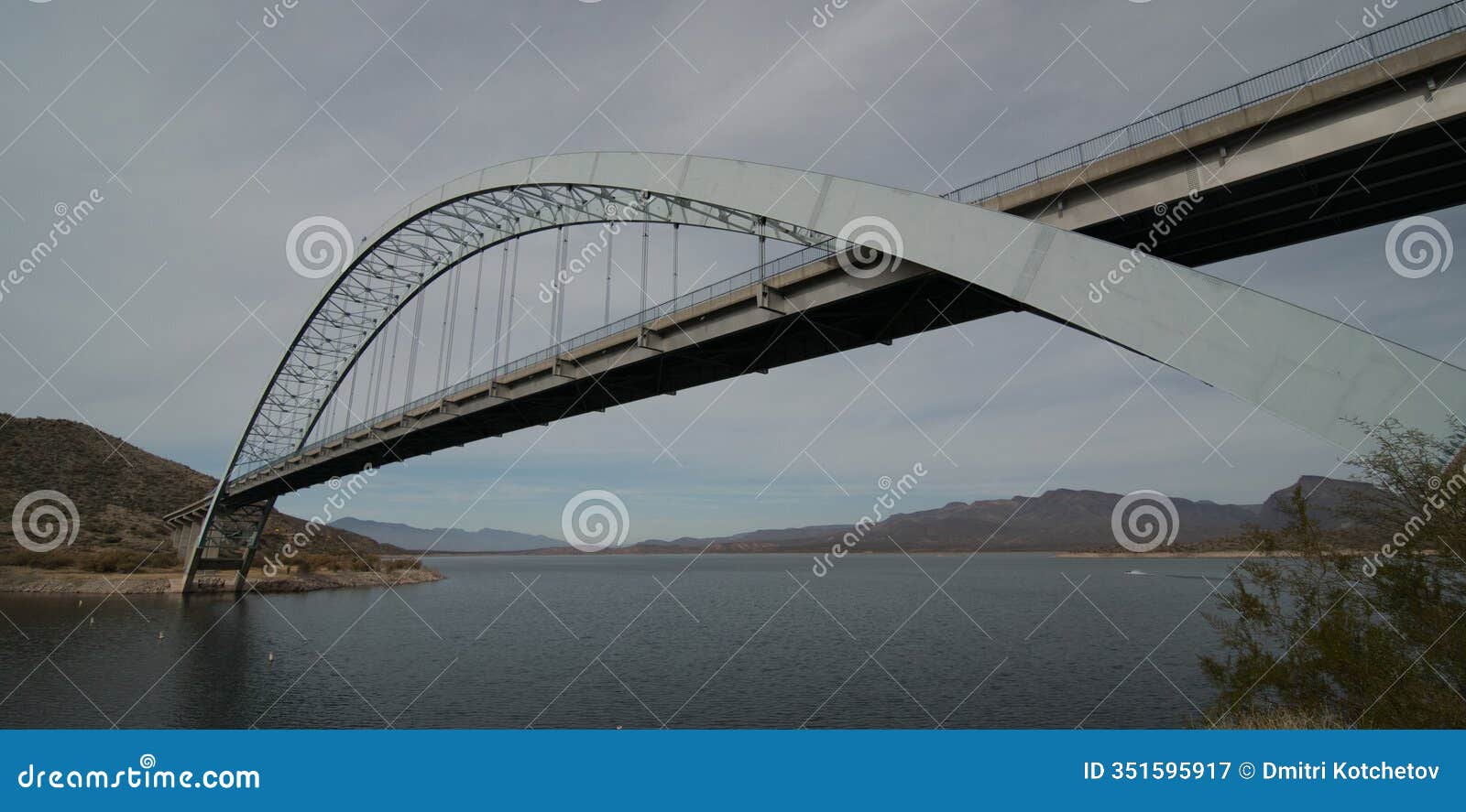 arc of theodore roosevelt lake bridge on overcast day - 2