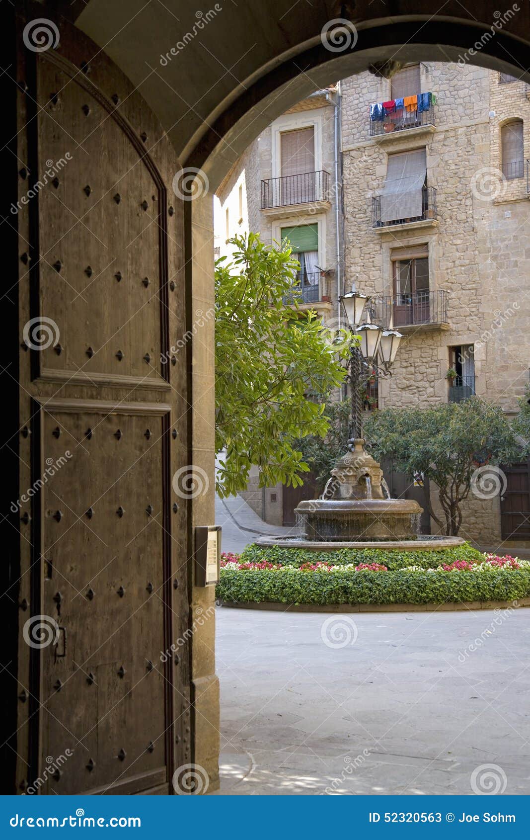 arch doorway with view of courtyard in solsona, cataluna, spain