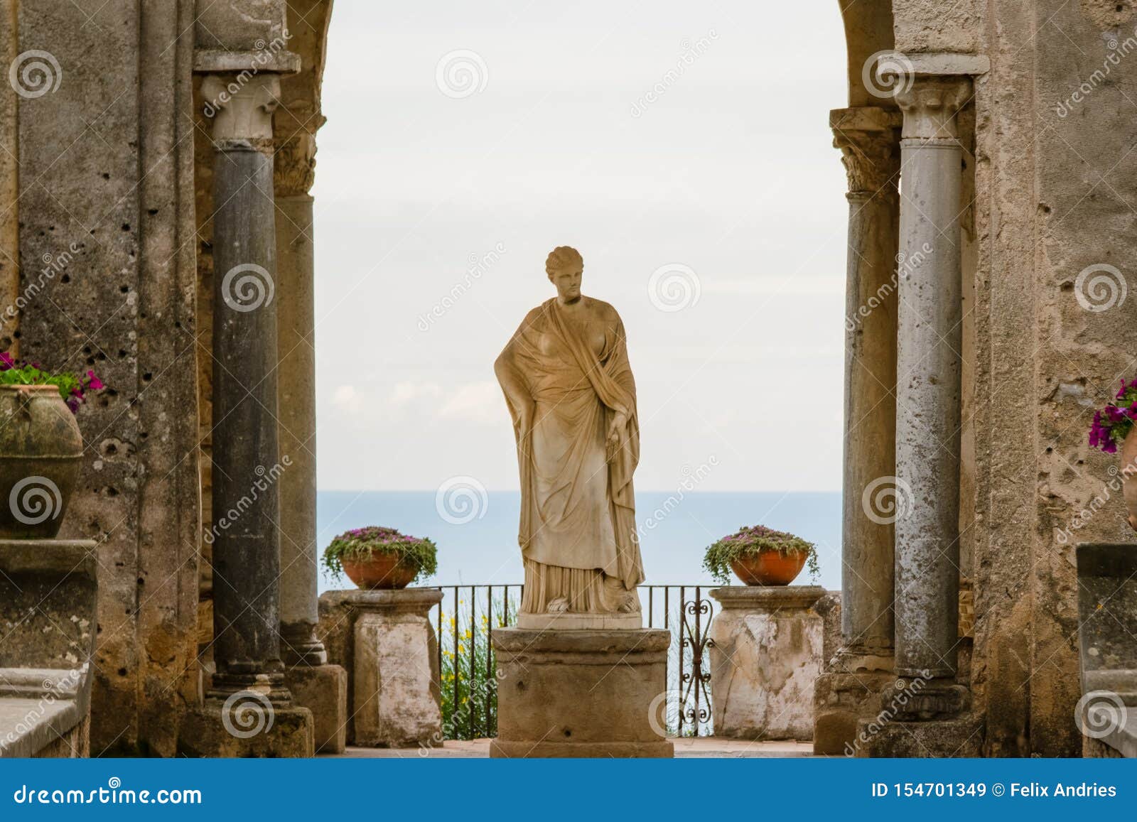 arch with a statue at the entrance to the terrace of infinity or terrazza dell`infinito, villa cimbrone, ravello  village, amalfi