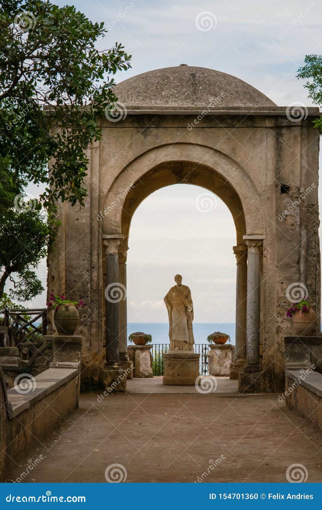 arch with a statue at the entrance to the terrace of infinity or terrazza dell`infinito, villa cimbrone, ravello  village, amalfi