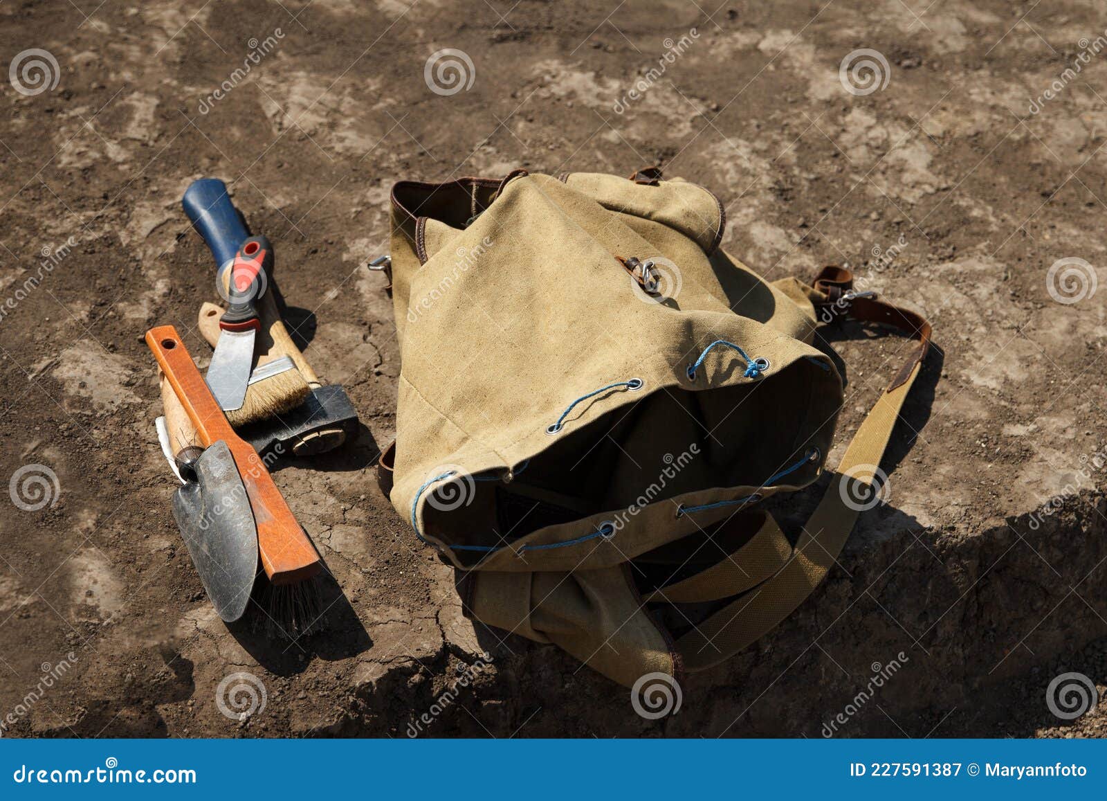 Archaeological Backpack and Working Tools for Excavating Ancient Artifacts in Clay Soil Stock
