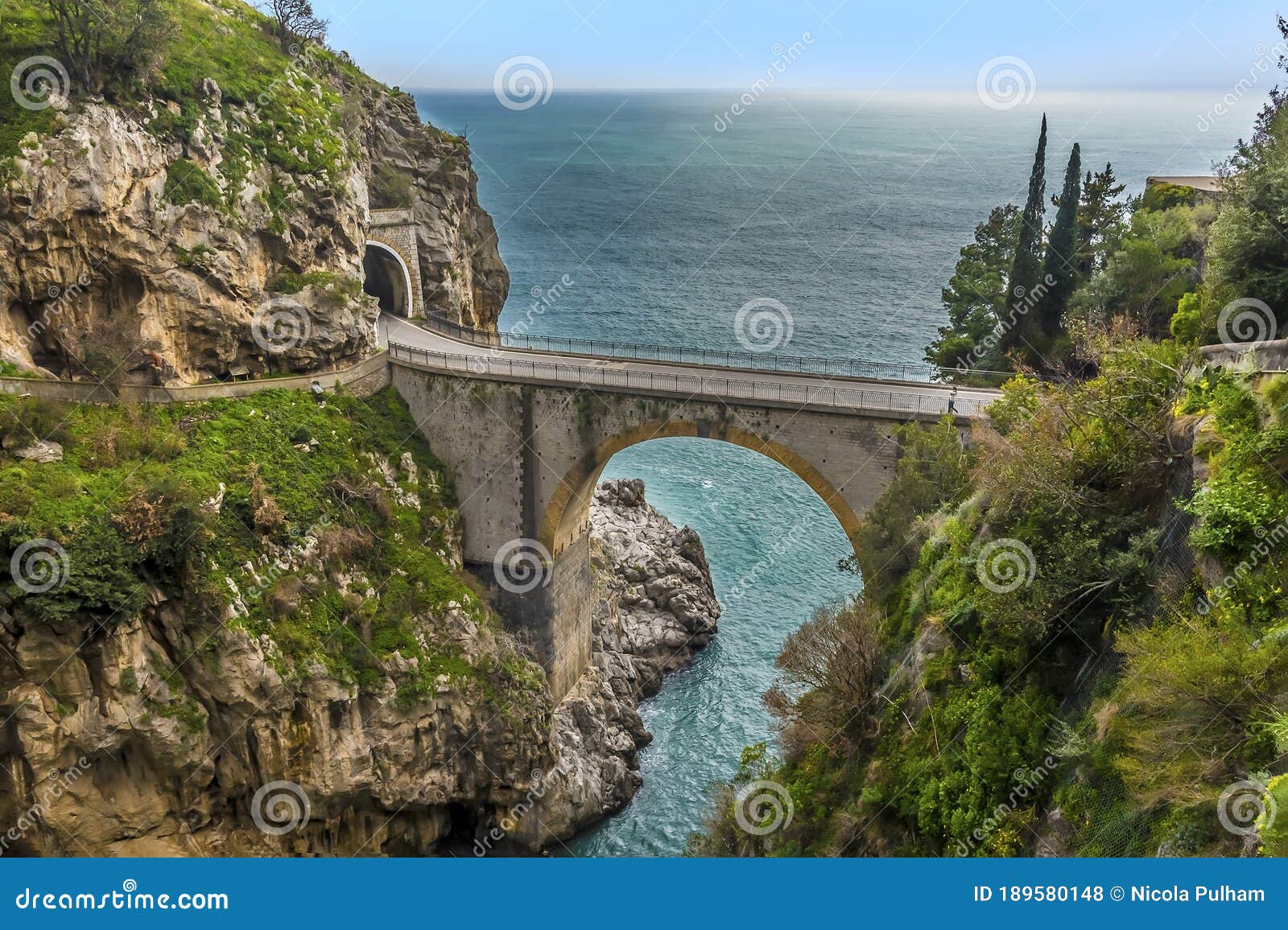 the arched bridge at fiordo di furore on the amalfi coast, italy on a sunny day