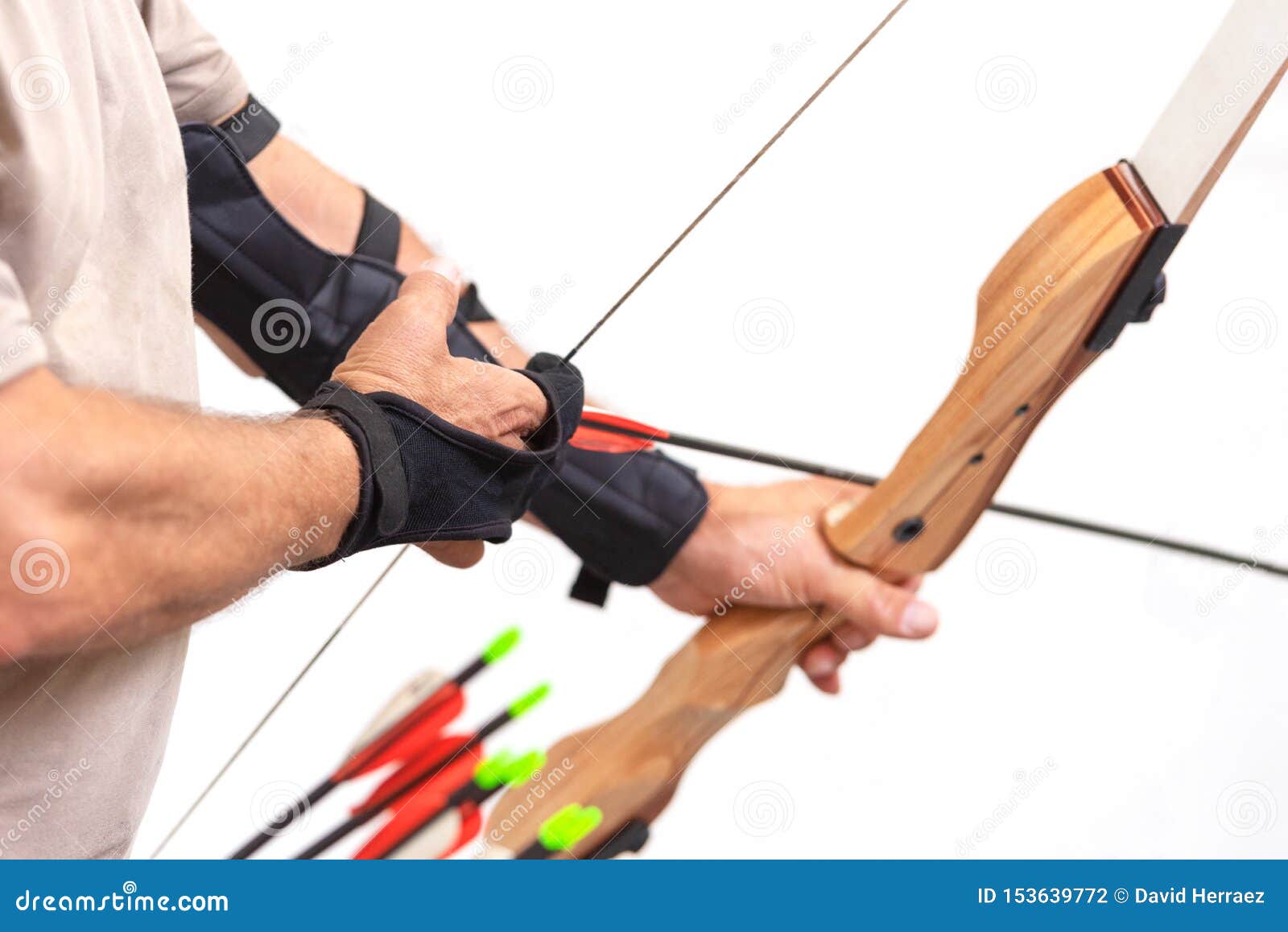 Archer Close Up, Preparing The Arrow For The Shot, On White Isolated