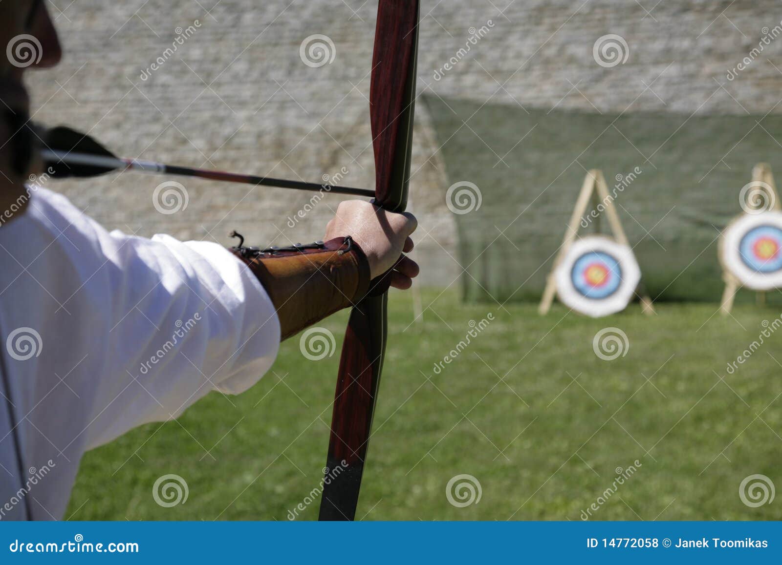 Archer shooting a long bow stock photo. Image of field 14772058