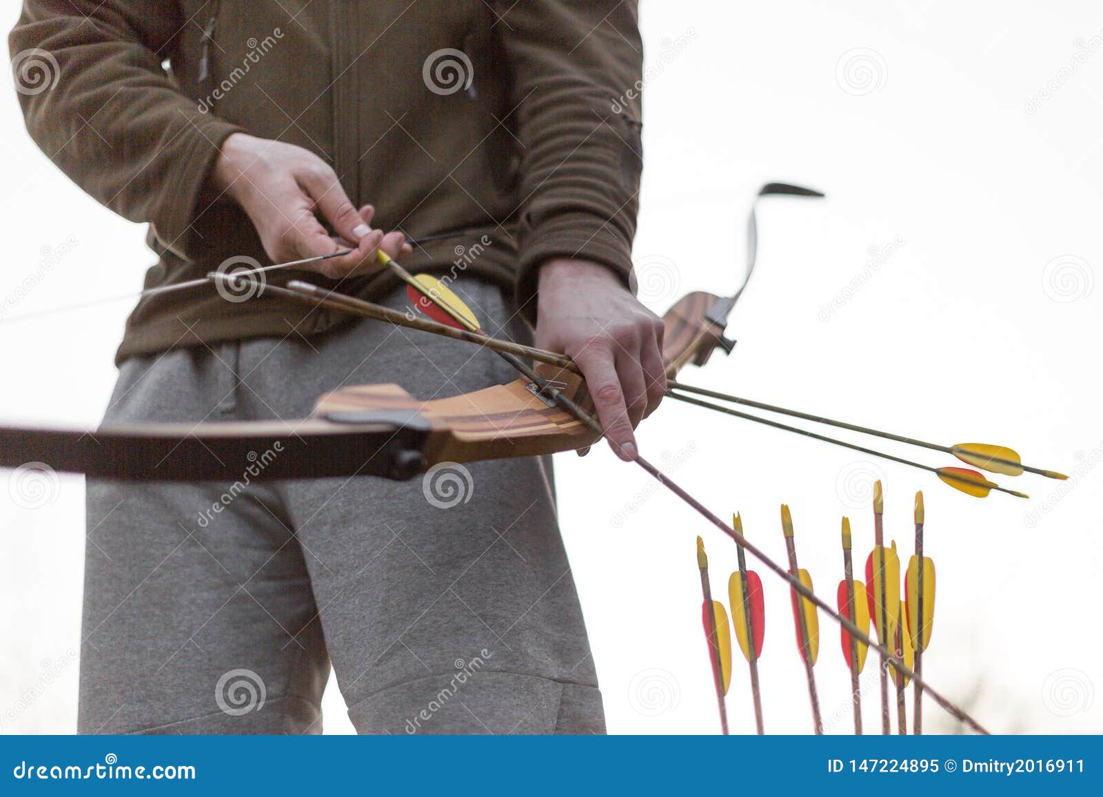 Archery. Male Hands with a Bow. Cropped Image. Stock Image Image of