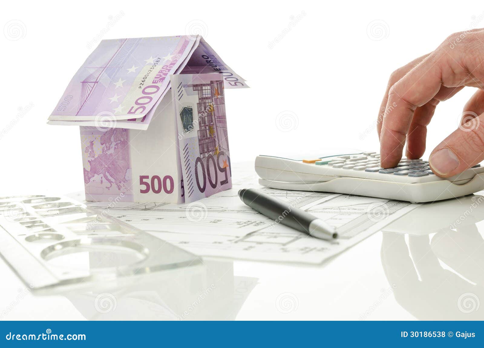 architect calculating costs house construction blueprints house made money his desk over white background 30186538