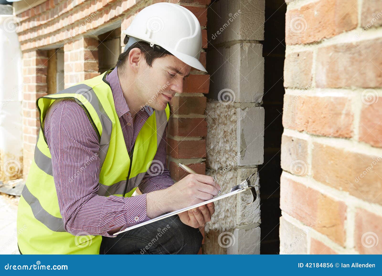 architect checking insulation during house construction
