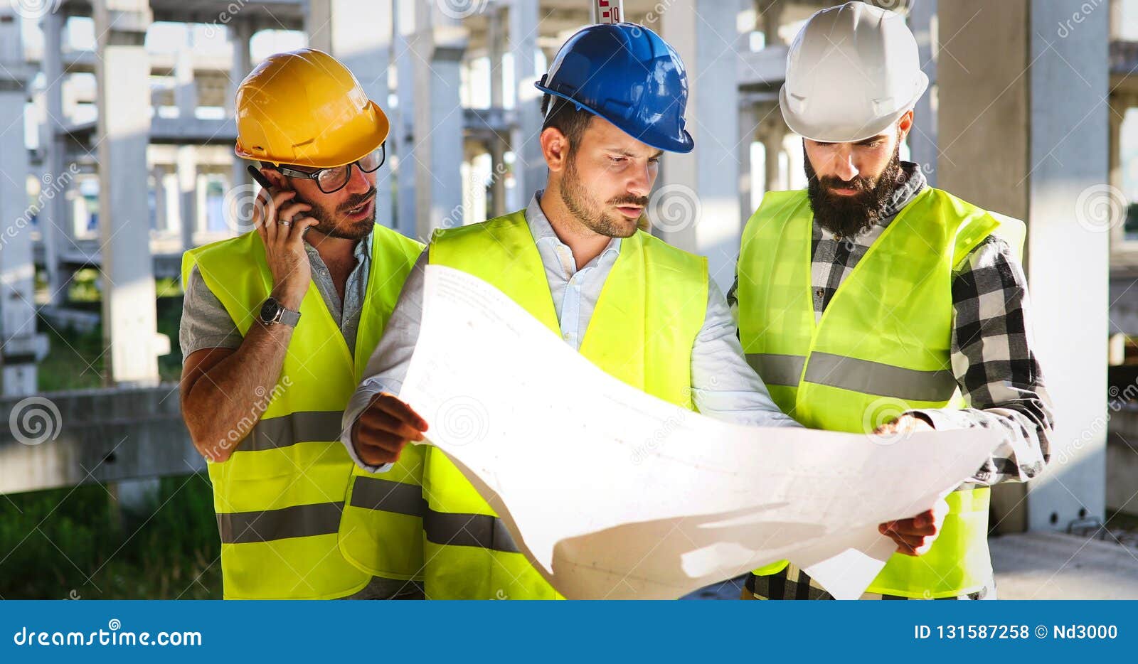 Architect Consult Engineer on Modern Construction Site Stock Photo