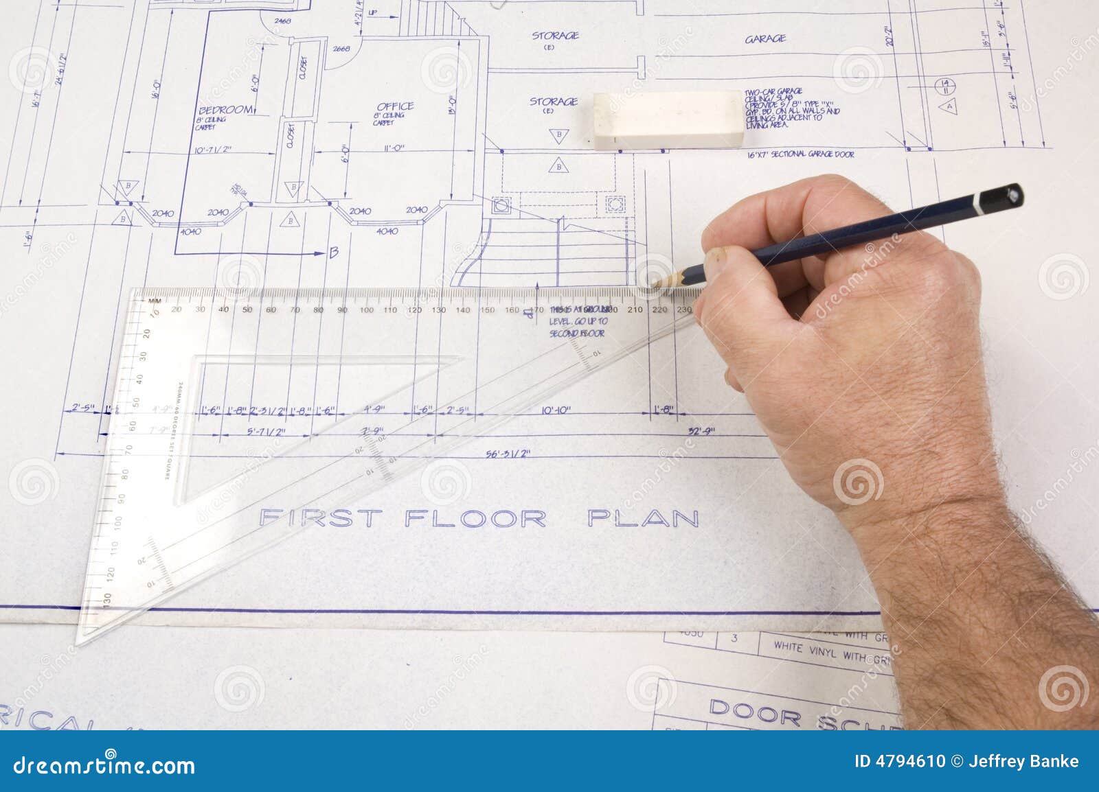 Architect Drawing  Up  Plans  For A House  Stock Photo 