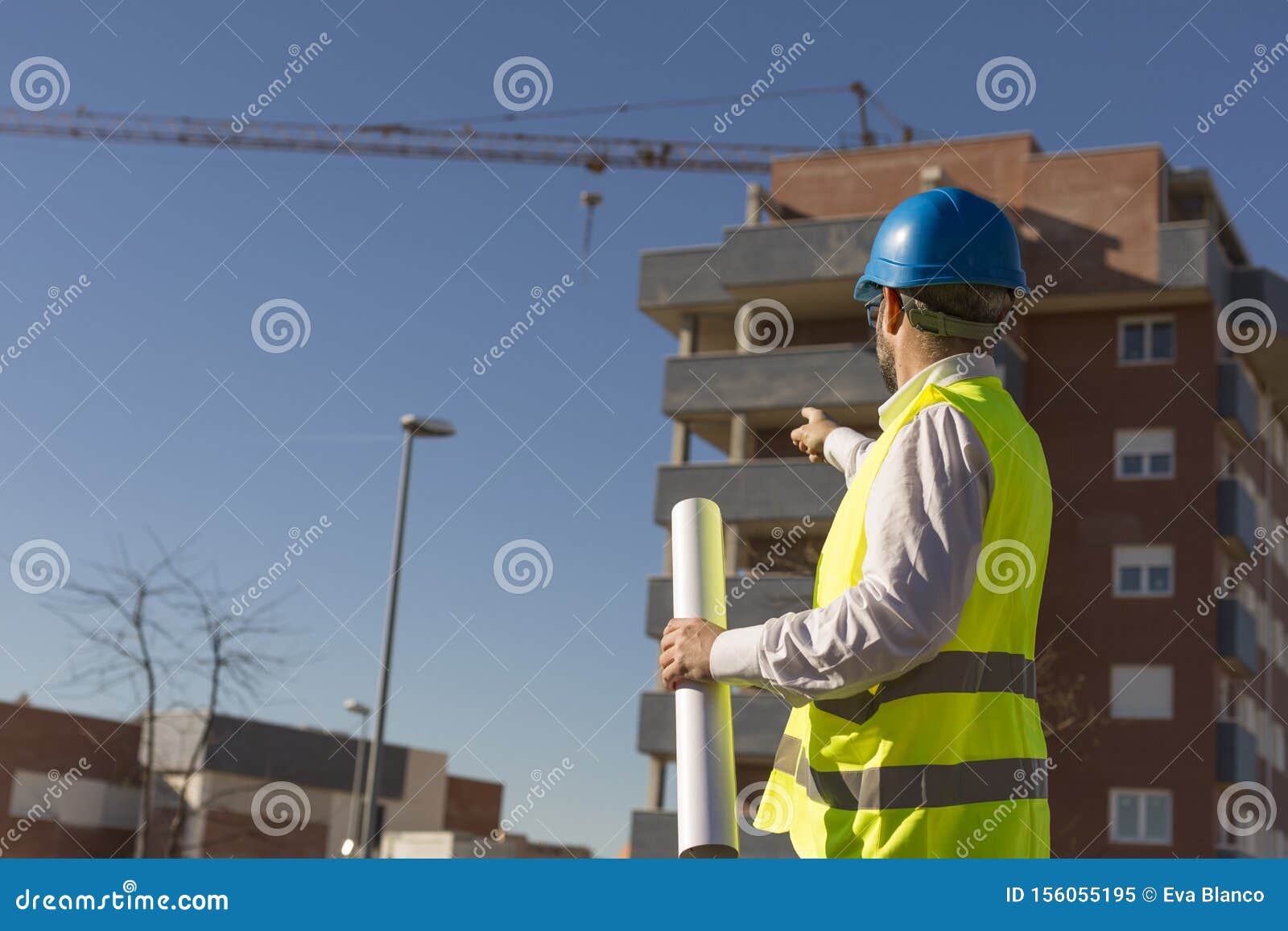 Architect or Engineer Holding Blueprints on the Construction Sit Stock ...