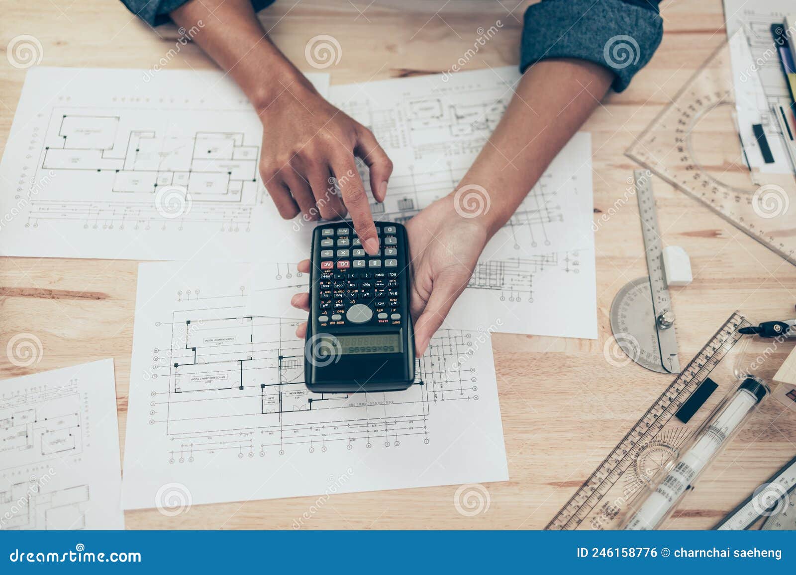 Architect Engineer Use Calculator for Calculate Drawing Design Working