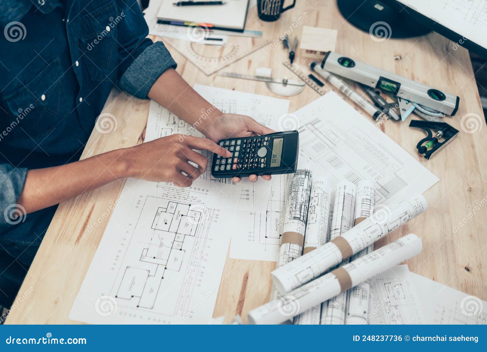 Architect Engineer Use Calculator for Calculate Drawing Design Working