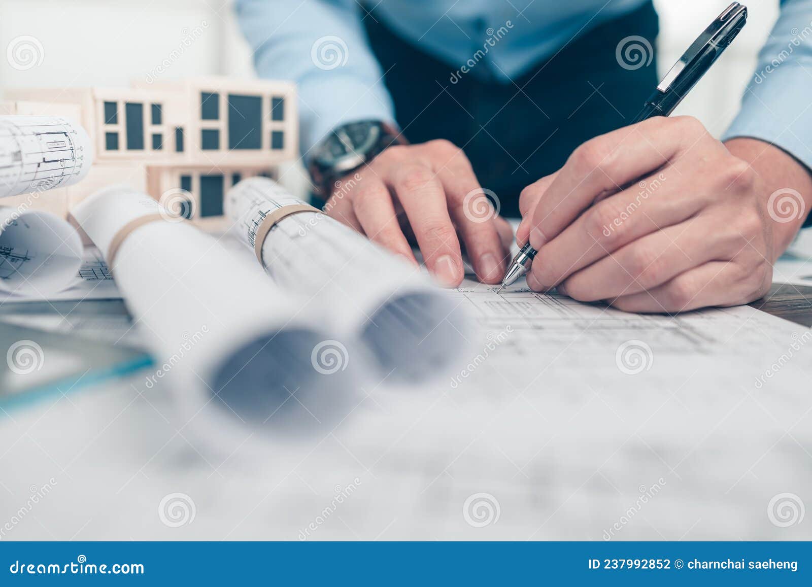 Architect Engineer Use Pen Drawing Design Working on Blueprint. House