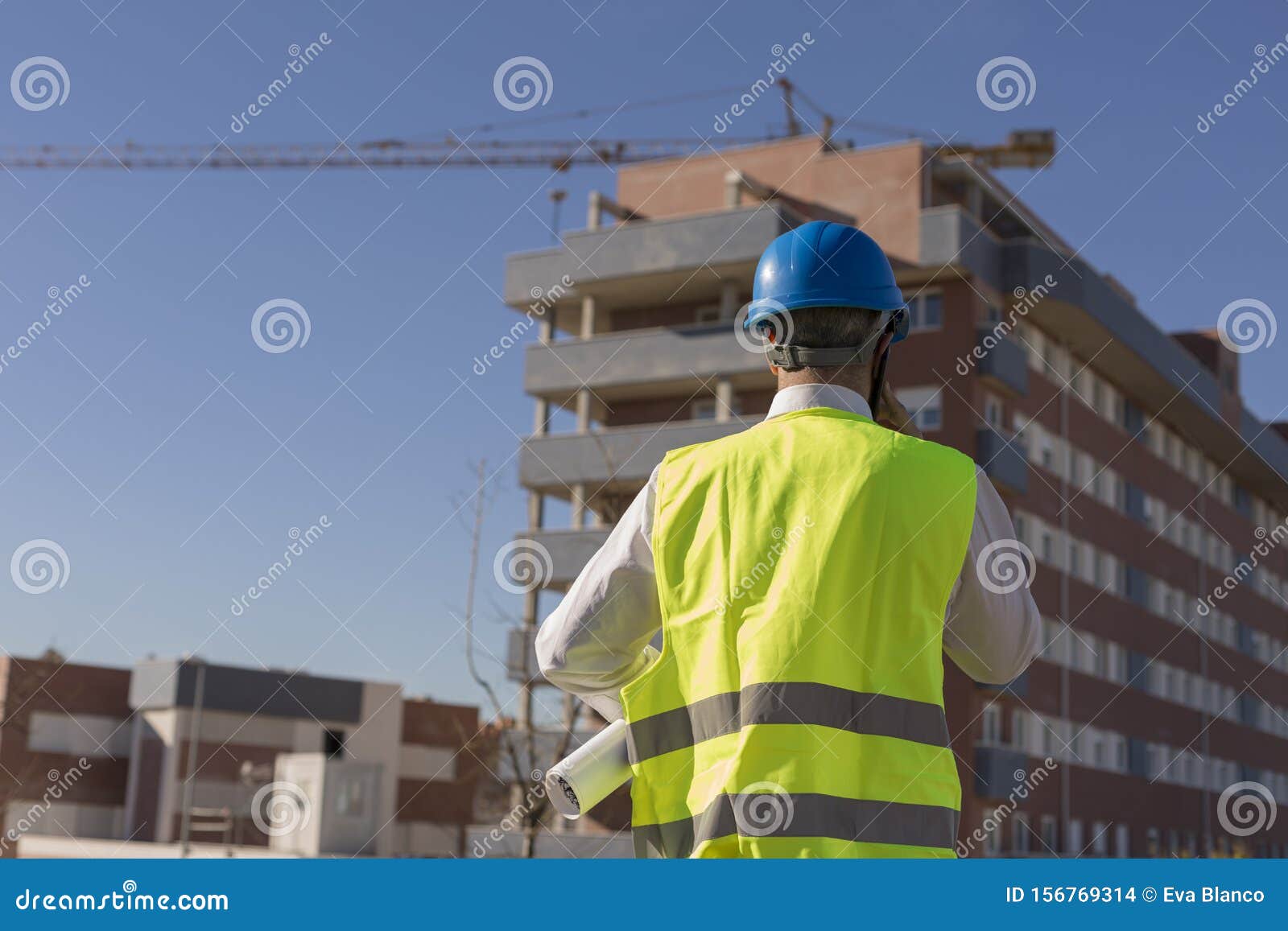 Architect or Engineer Using Mobile Phone on the Construction Site ...