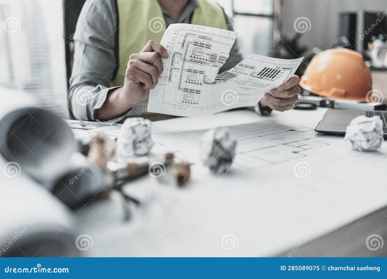 the architect made a mistake in ing the plan and torn paper. paper crump on blueprint. fail, mistake and problem concept