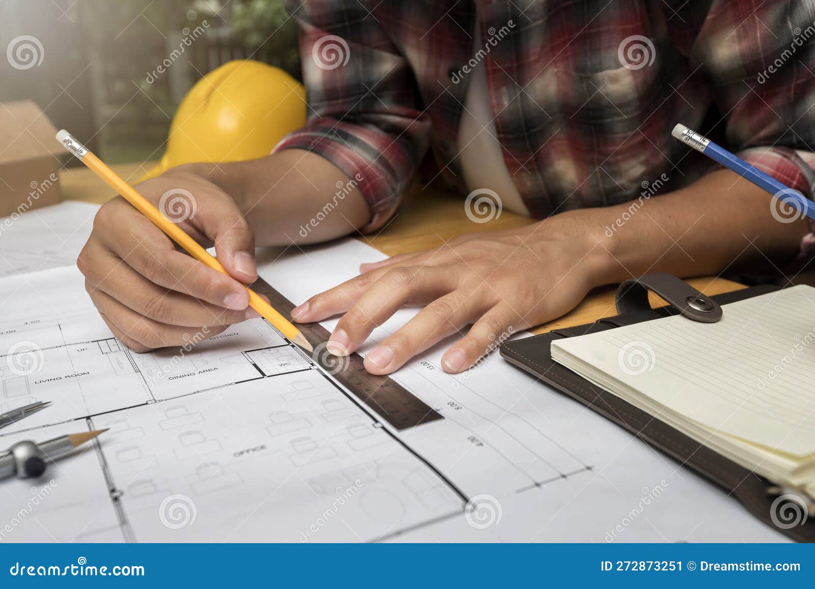 Architect Measuring Scale on Blueprint in Construction Site Stock Image