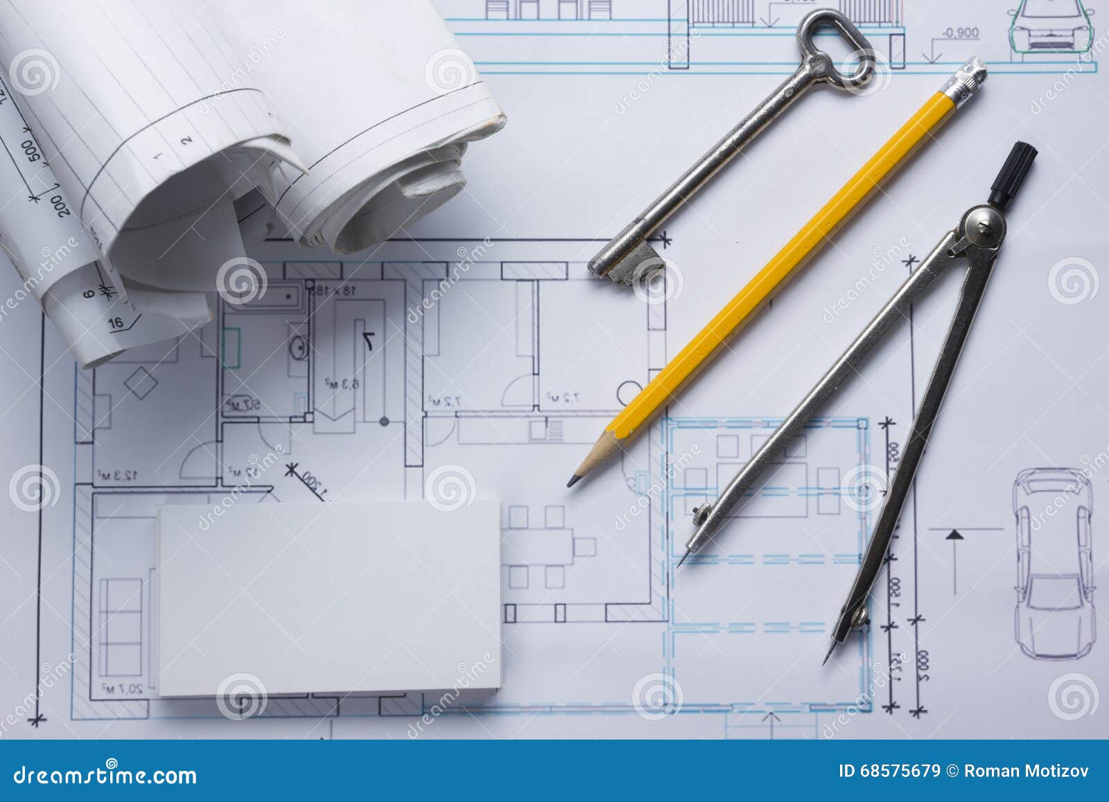 architect worplace top view. architectural project, blueprints, blueprint rolls and divider compass, key, blank
