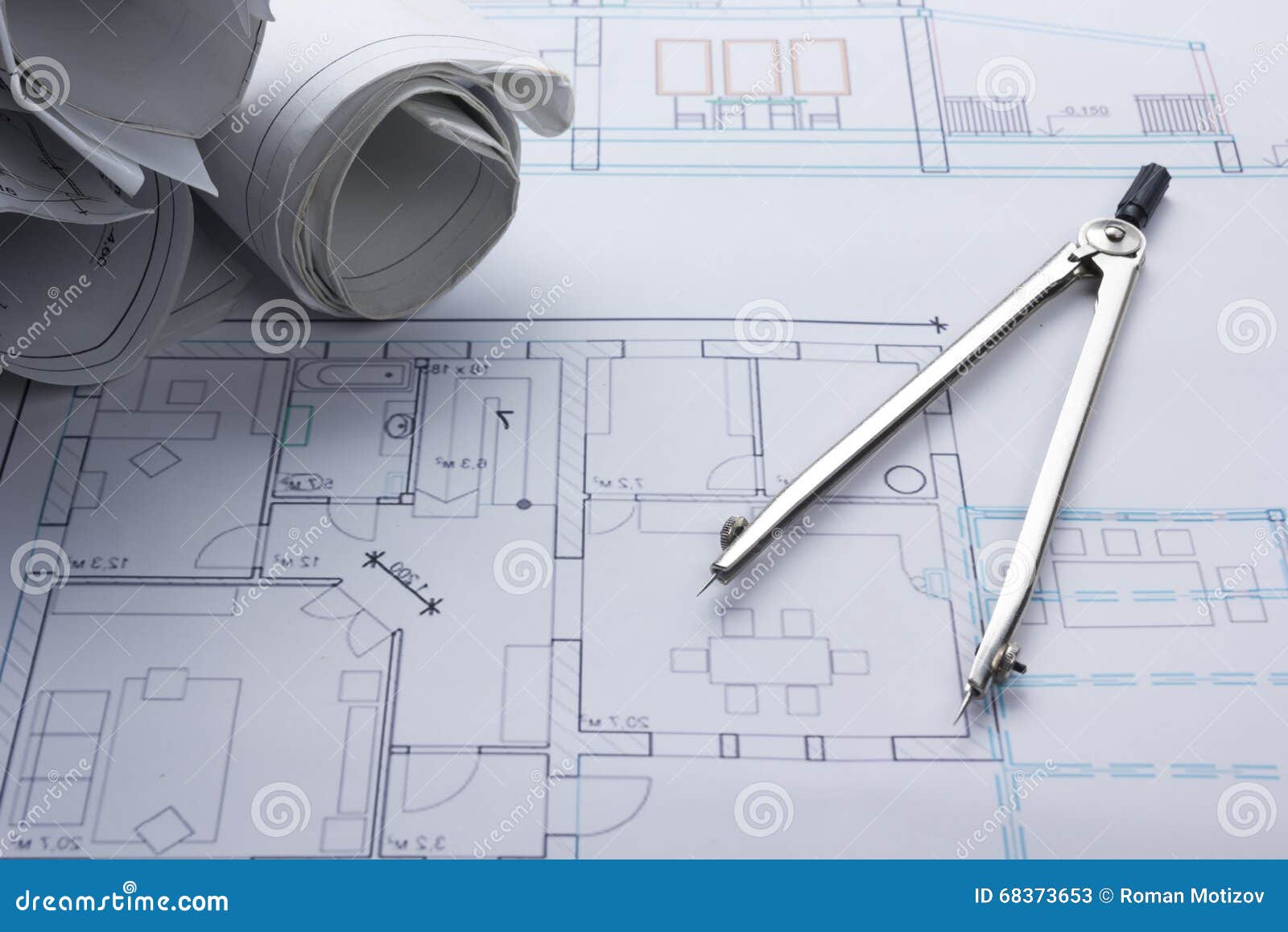 architect worplace top view. architectural project, blueprints, blueprint rolls and divider compass on plans