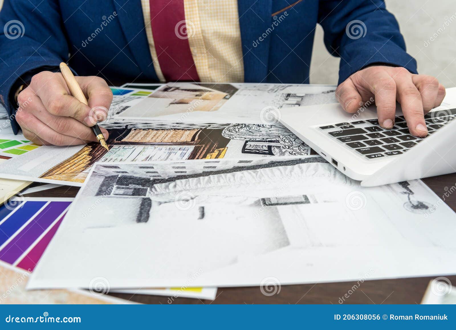 architects hands drawing of modern apartaments with colour sample and laptop on creative desk, office. man choosing colors for
