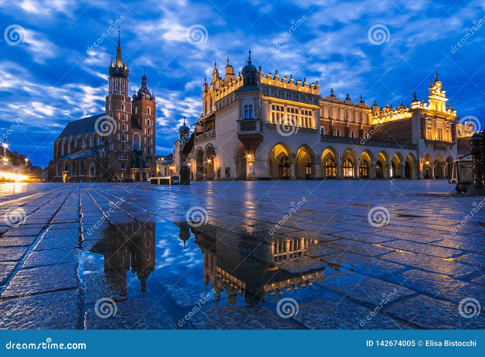 the architecture at the rynek glowny square with the church of st mary in the old town of kracow in poland in east europe at blue