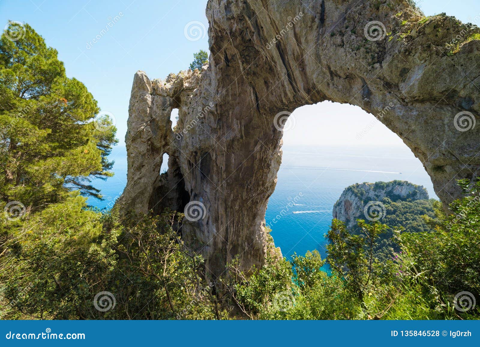 arco naturale, natural arch on coast of capri island, italy