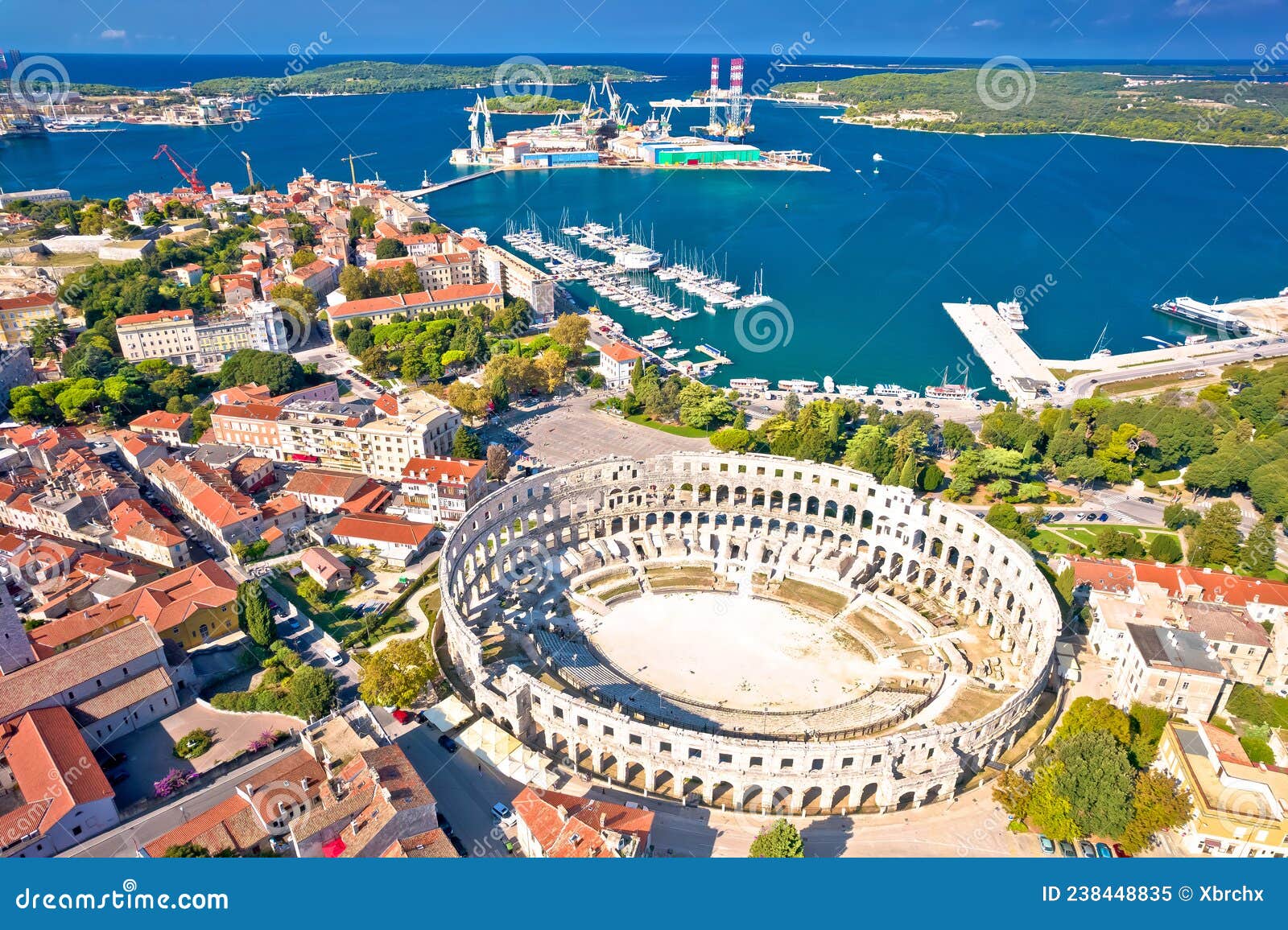 arena pula. ancient ruins of roman amphitheatre and pula waterfront aerial view