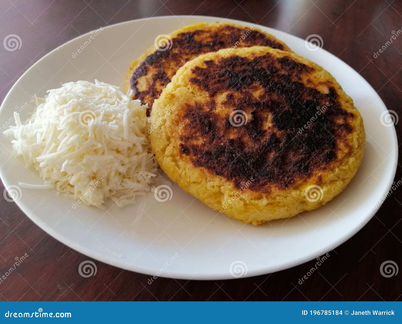 Arepas In A White Plate With Colombian Hogao Sauce Cooked Tomato And