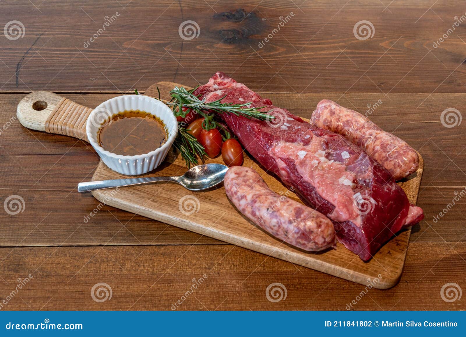 Argentine Cut of Meat Called Vacio with Chorizos and Chimichurri Stock