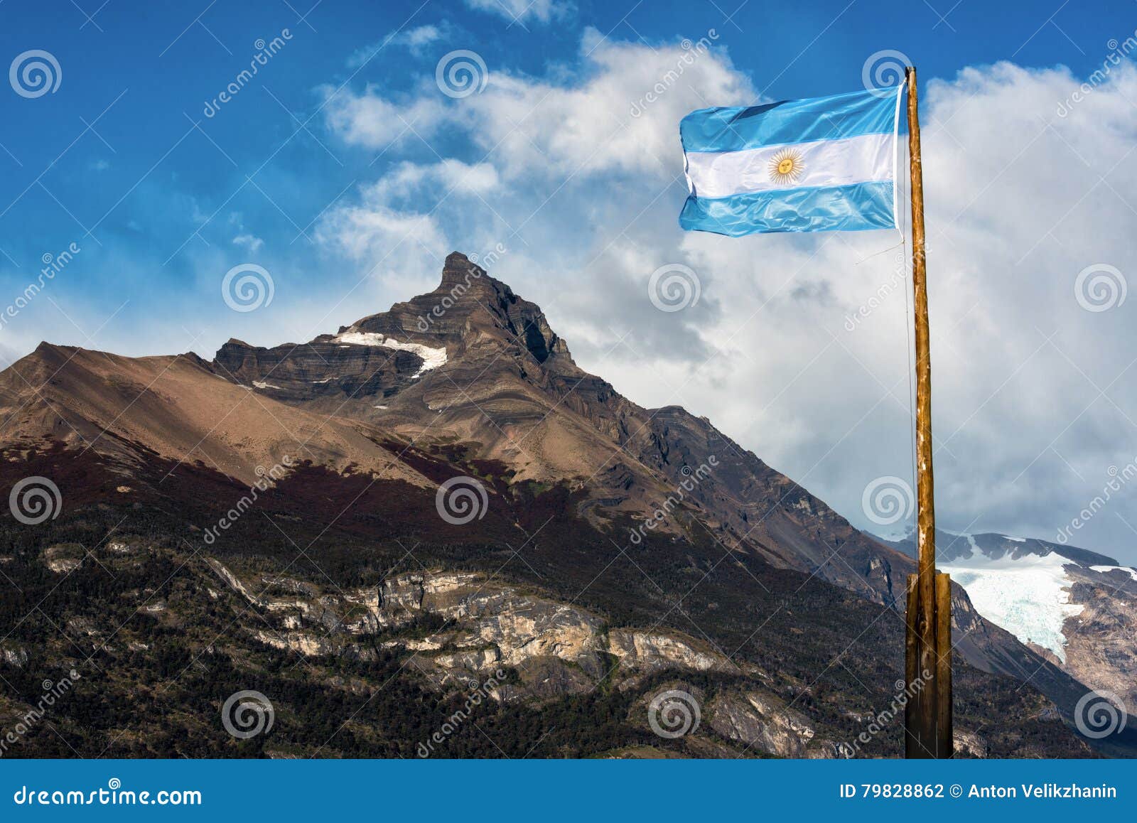 argentine flag flying in front of the mountain