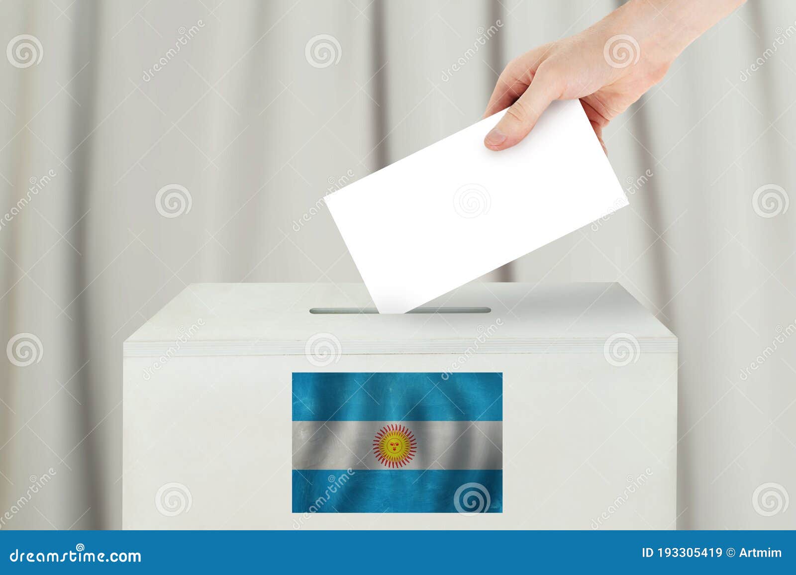 argentinean vote concept. voter hand holding ballot paper for election vote on polling station