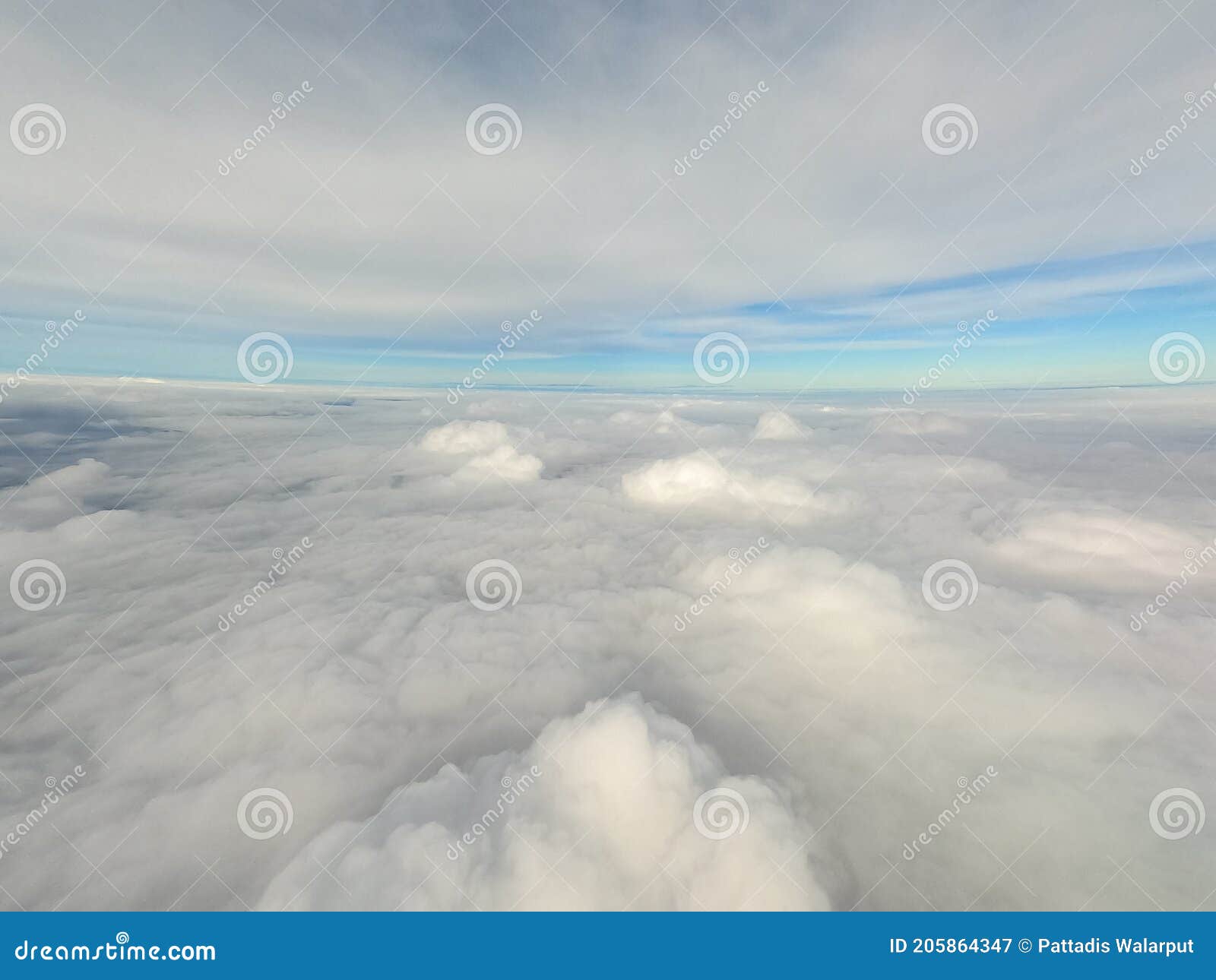arial view from internal cabin of aeroplane.clouds in the sky and cityscapes though airplane window