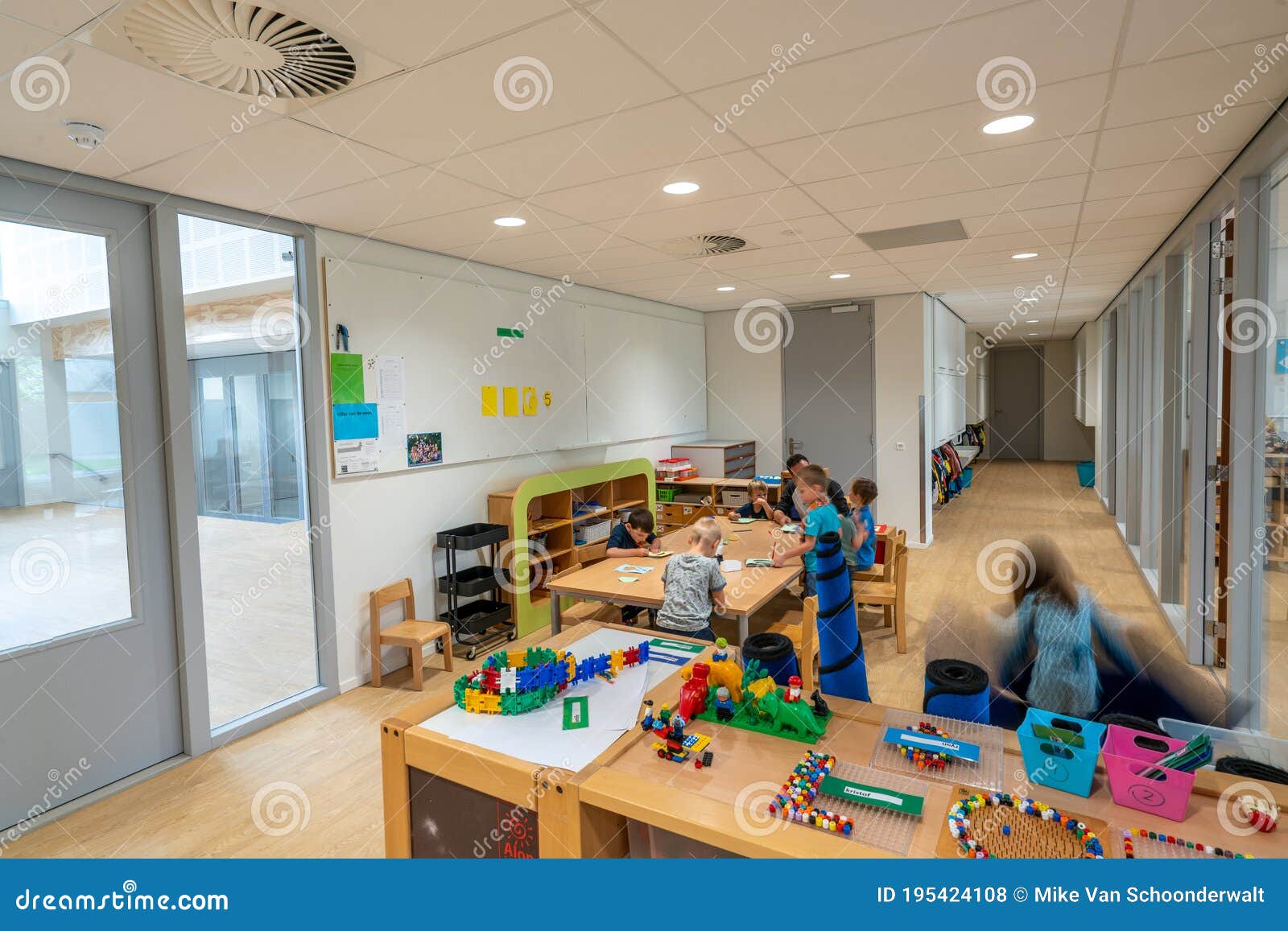 ARNHEM / NETHERLANDS AUGUST 28 2020: Children in Kindergarten Play with Toys. Toys Stored in Cupboards, Boxes and Crates Editorial Stock Photo - Image of childhood, home: 195424108