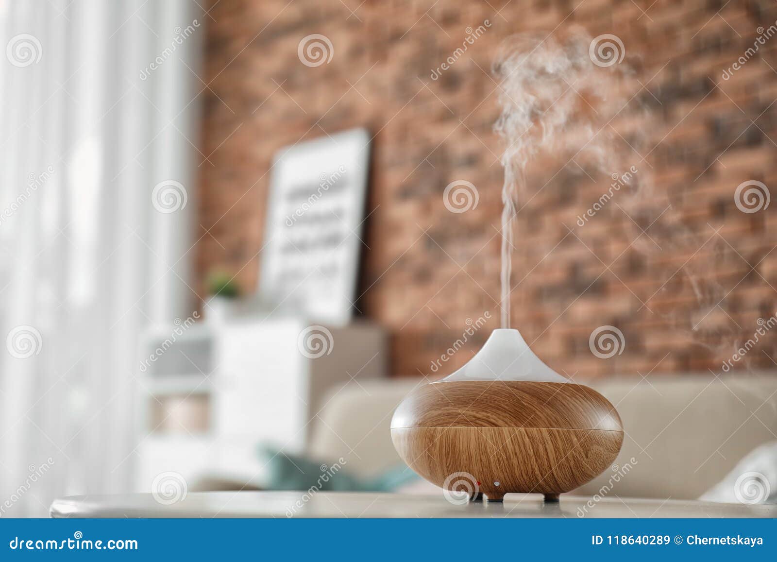 aroma oil diffuser on table at home