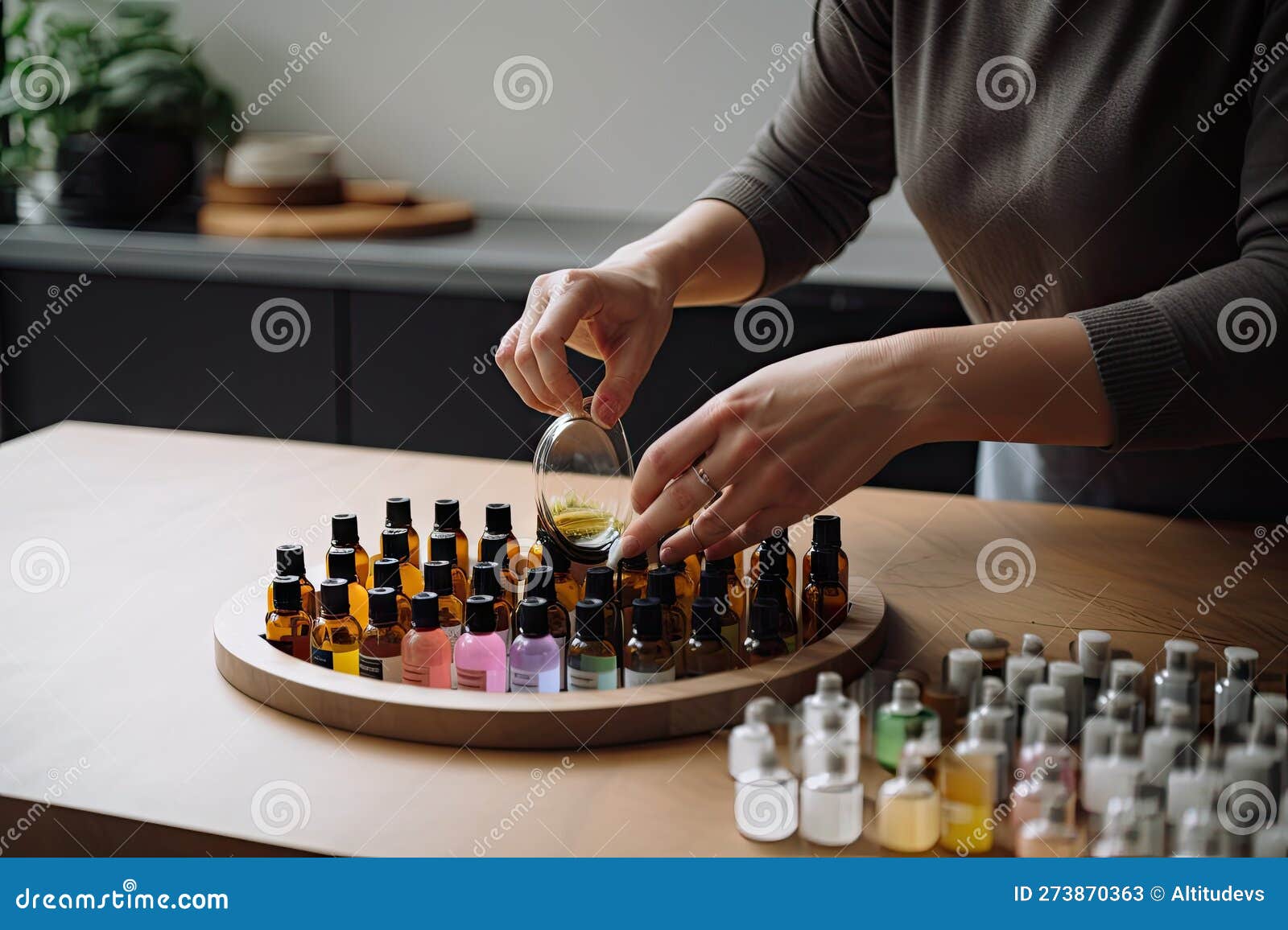 Aromatherapist Mixing Essential Oils and Preparing the Perfect Blend