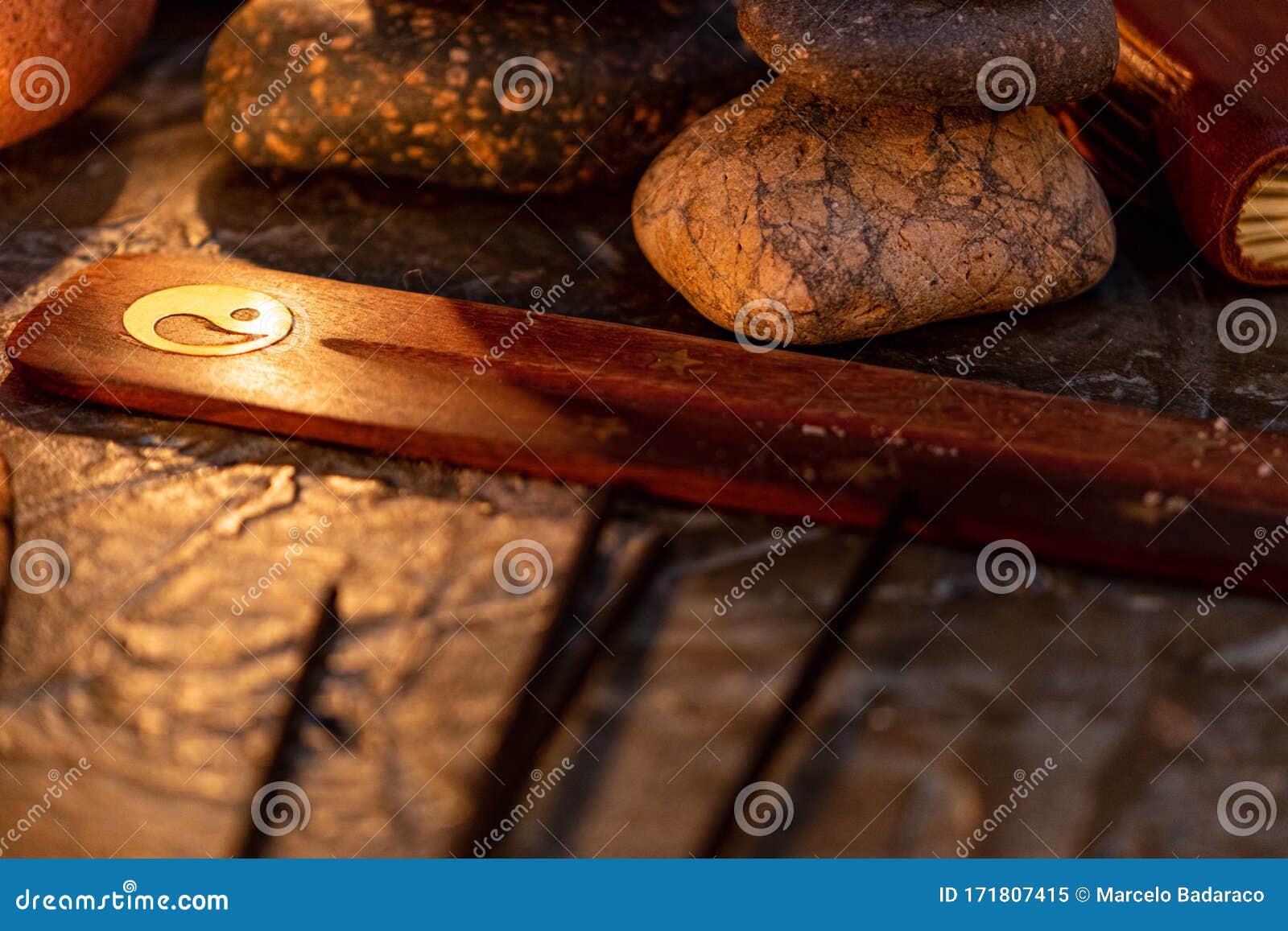 lighted candles with ornate wood and scented and energetic incense