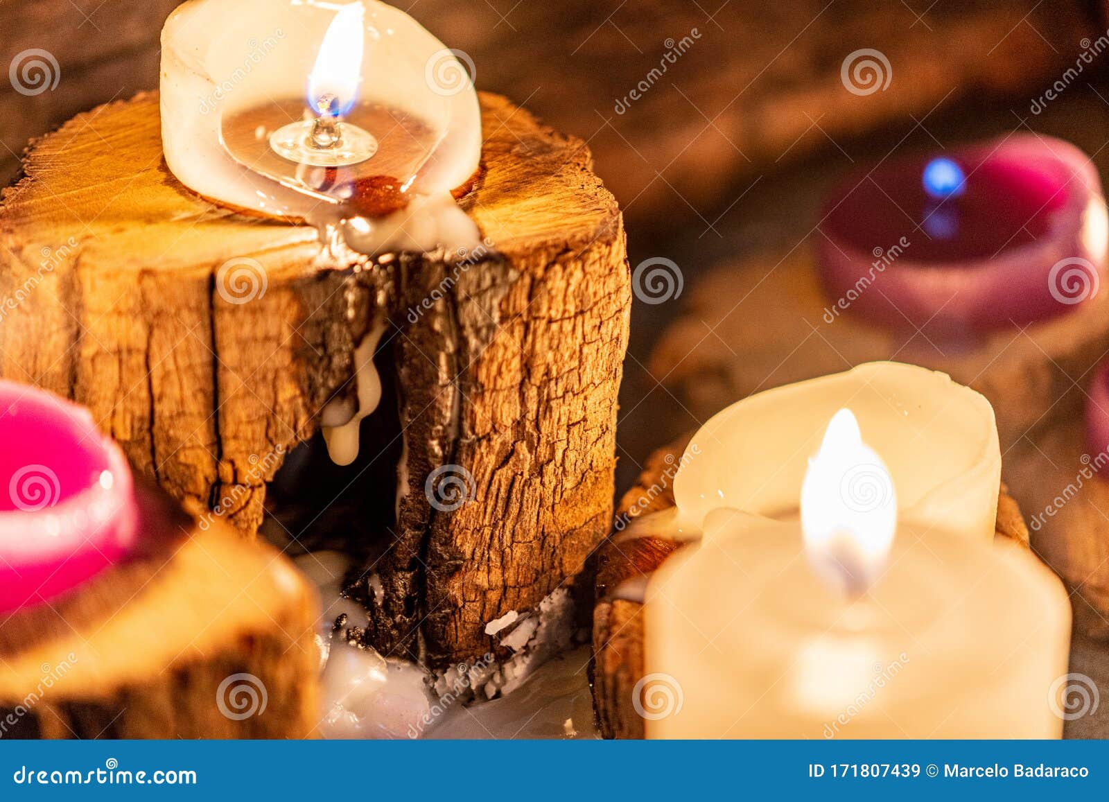 lighted candles with ornate wood and scented and energetic incense