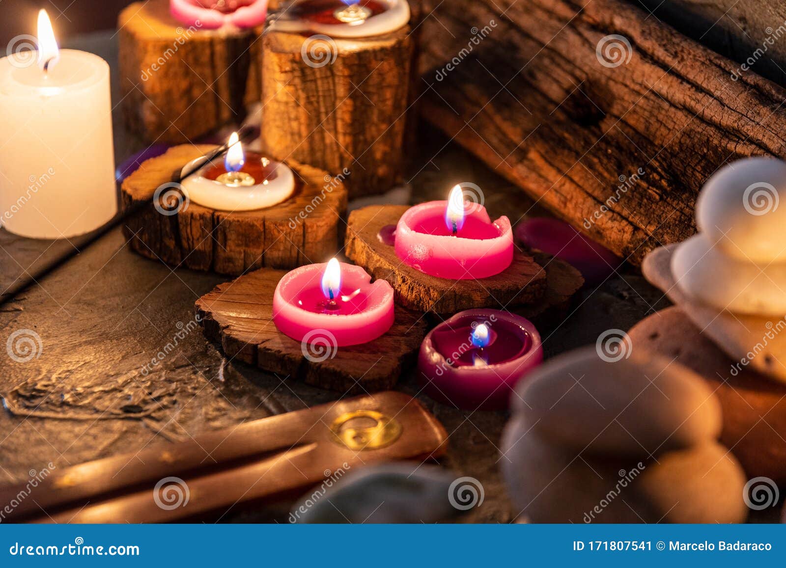 lighted candles with ornate wood and scented and energetic incense