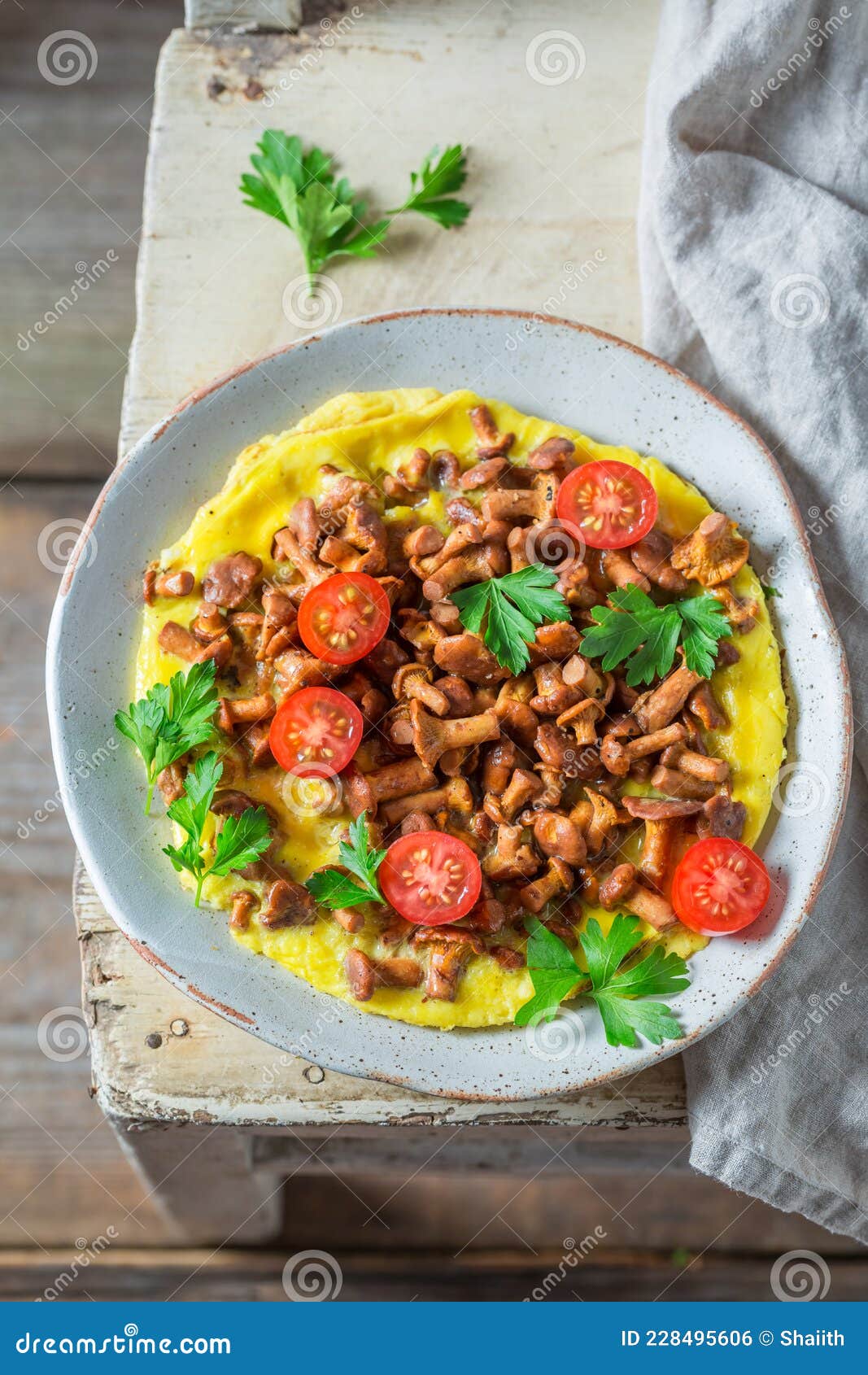 Aromatic Omelette Made of Chanterelles Mushrooms and Tomatoes Stock