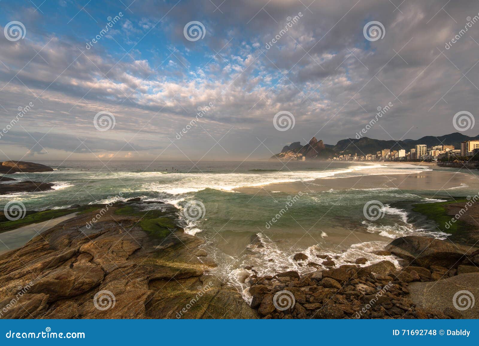 arpoador beach rocks and dramatic sky above rio de janeiro