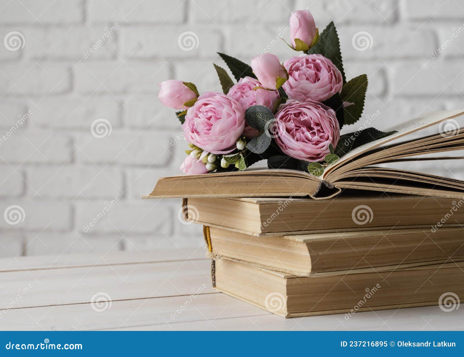 Arrangement with Books Beautiful Flowers. High Quality Photo Stock ...