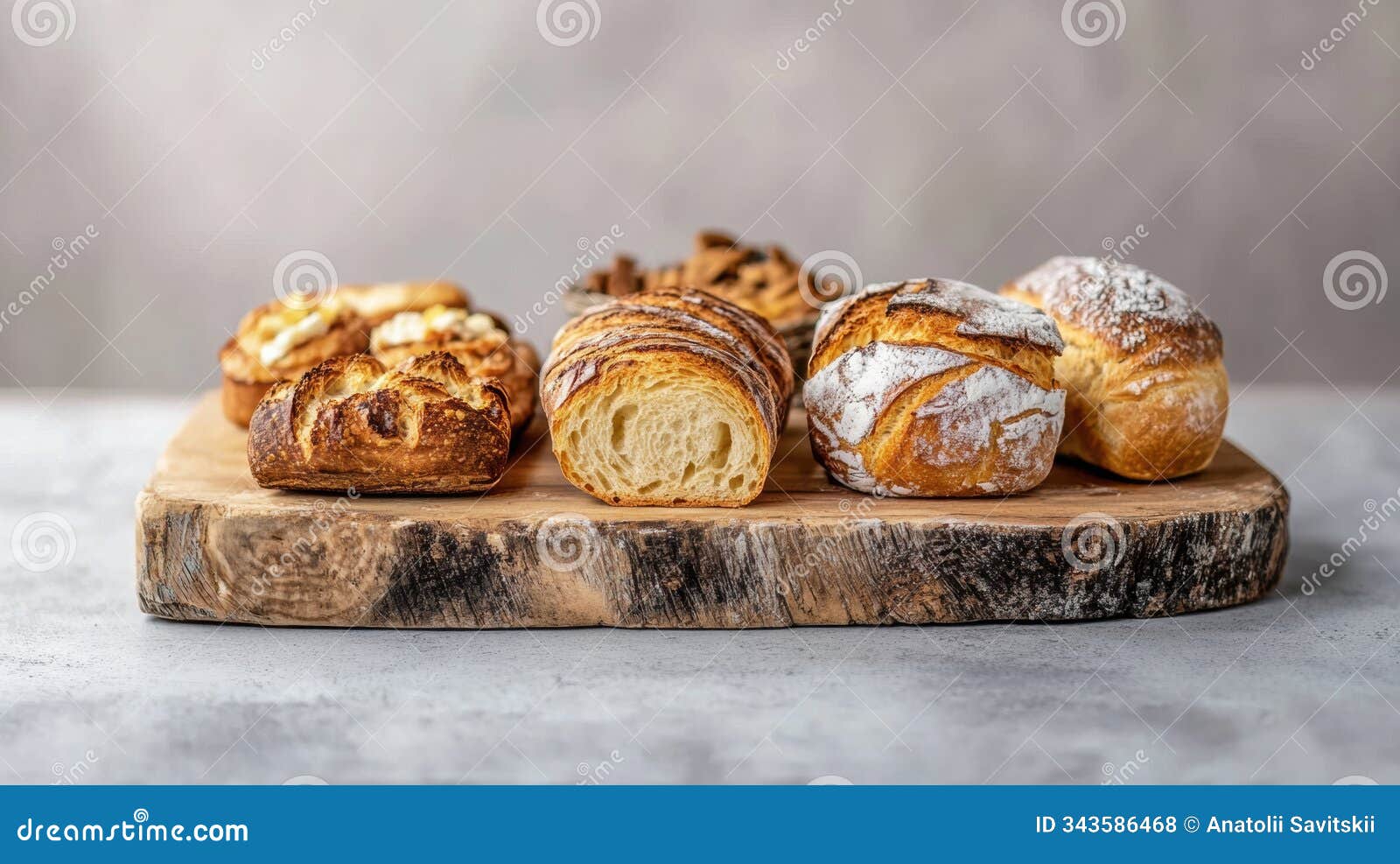 an array of assorted artisan bread and flaky pastries is elegantly arranged on a rustic wooden board, tempting snack