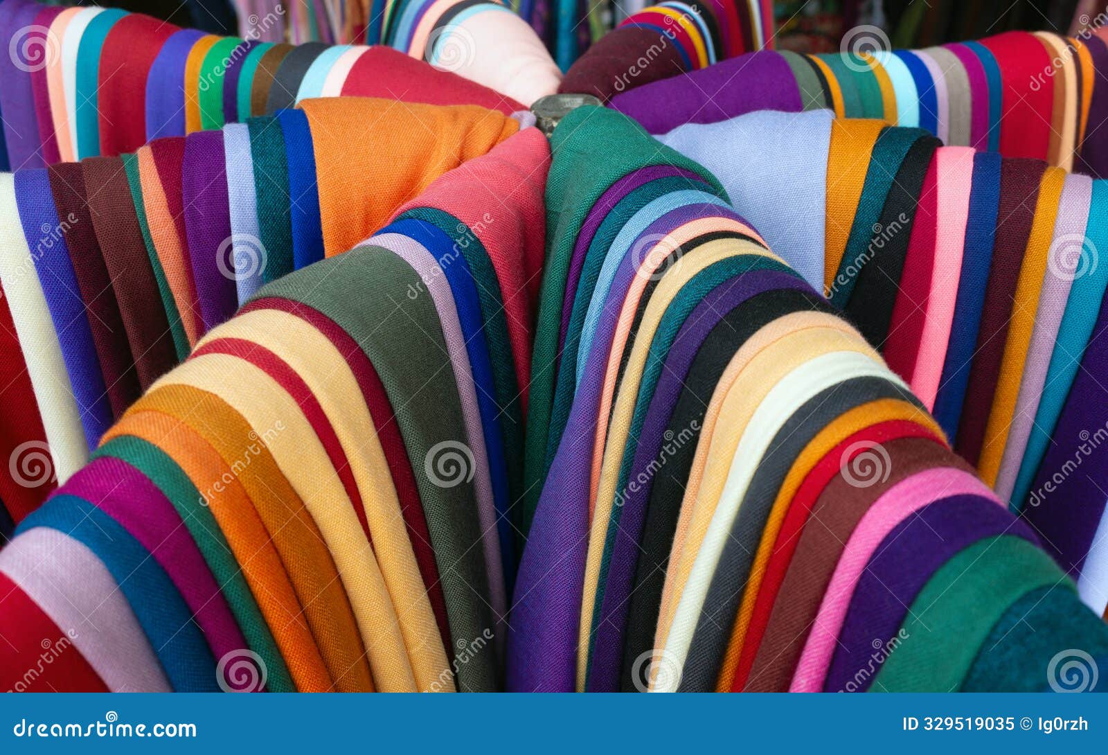 array of colorful fabric presented in market in istanbul, turkey